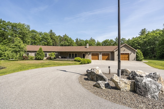 16 Keystone Spring Rd, Poland, ME 04274 - single story home featuring curved driveway, a garage, and a front lawn