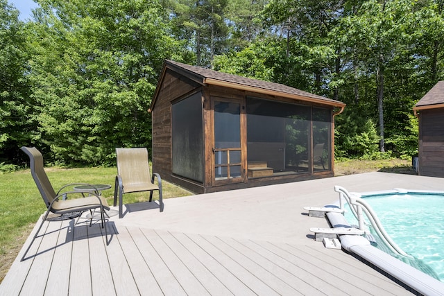 16 Keystone Spring Rd, Poland, ME 04274 - wooden terrace featuring an outdoor pool, a sunroom, and view of wooded area