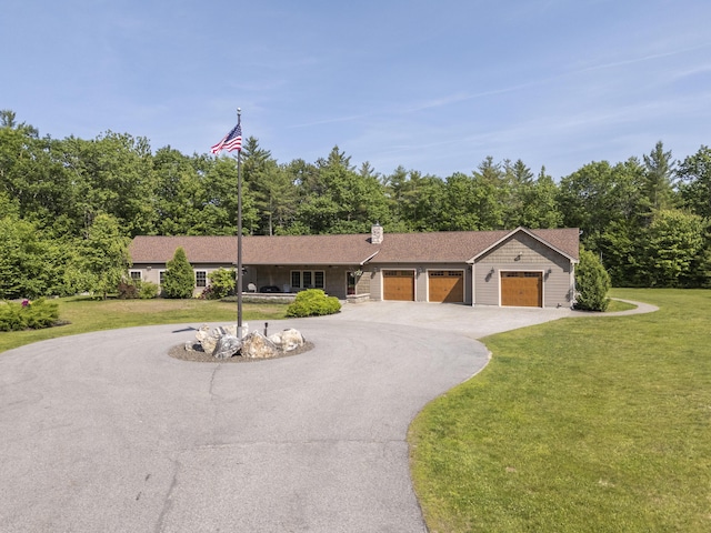 16 Keystone Spring Rd, Poland, ME 04274 - ranch-style home featuring a garage, a front lawn, driveway, and a chimney