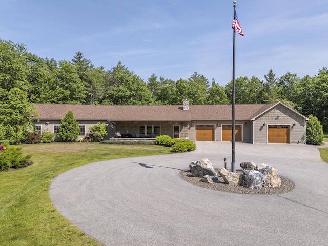 16 Keystone Spring Rd, Poland, ME 04274 - single story home featuring an attached garage, curved driveway, a front lawn, and a chimney