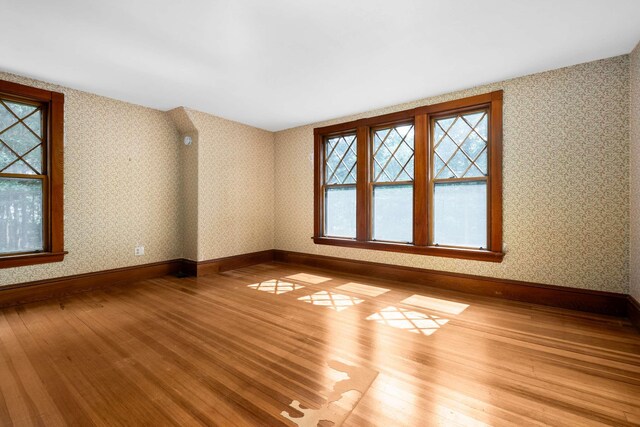 4 Fairbourne Ln, York, ME 03902 - unfurnished room featuring plenty of natural light, wood finished floors, and wallpapered walls