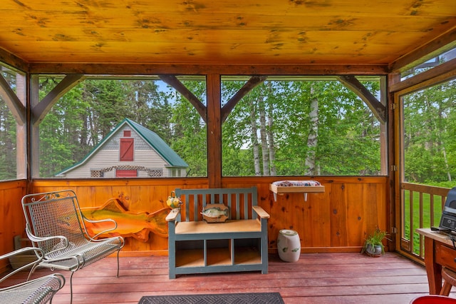 574 Mingo Loop Rd, Rangeley, ME 04970 - wooden deck with view of wooded area
