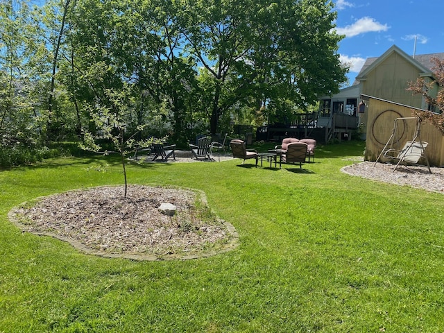 86 Summer St, Saco, ME 04072 - view of green lawn featuring a fire pit and a wooden deck