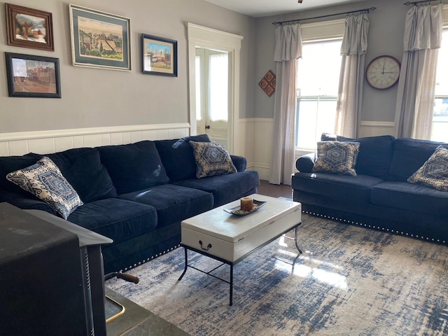 86 Summer St, Saco, ME 04072 - living area featuring wainscoting and healthy amount of natural light