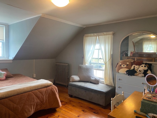 86 Summer St, Saco, ME 04072 - bedroom featuring radiator heating unit, hardwood / wood-style flooring, multiple windows, ornamental molding, and lofted ceiling