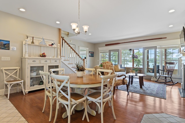 71 Village Way Unit 506, Edgecomb, ME 04556 - dining room featuring stairway, wood finished floors, a chandelier, and recessed lighting