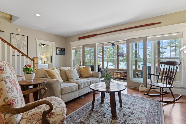 71 Village Way Unit 506, Edgecomb, ME 04556 - living room featuring a ceiling fan, wood finished floors, stairway, and recessed lighting