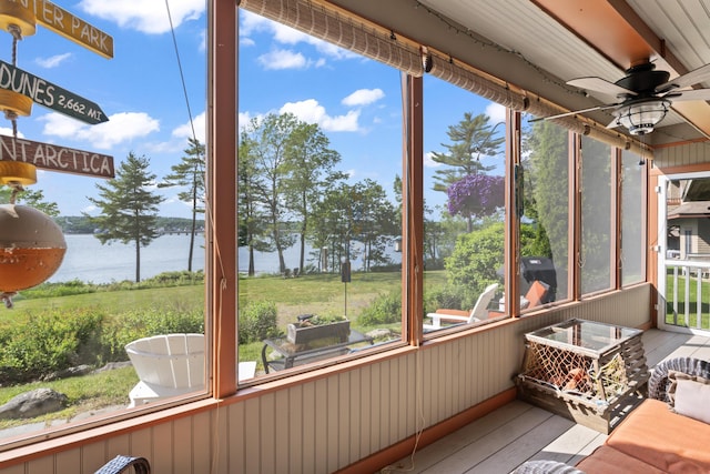 71 Village Way Unit 506, Edgecomb, ME 04556 - sunroom featuring a water view, ceiling fan, and healthy amount of natural light