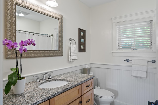 71 Village Way Unit 506, Edgecomb, ME 04556 - bathroom with a wainscoted wall, vanity, and a shower with shower curtain