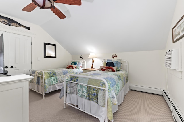 71 Village Way Unit 506, Edgecomb, ME 04556 - carpeted bedroom featuring lofted ceiling, a baseboard heating unit, a ceiling fan, and a wall unit AC