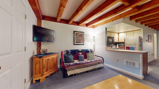 9 Cherry Ln Unit 11, Bethel, ME 04217 - living room with carpet floors and beamed ceiling