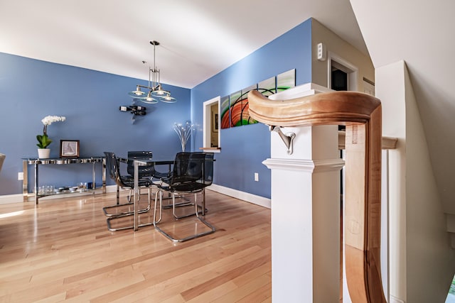 148 Breakwater Dr Unit 17, South Portland, ME 04106 - dining space featuring wood finished floors and a chandelier