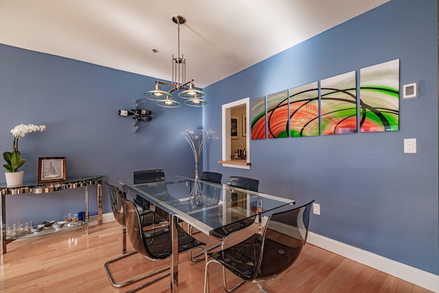 148 Breakwater Dr Unit 17, South Portland, ME 04106 - dining room featuring wood finished floors and a chandelier