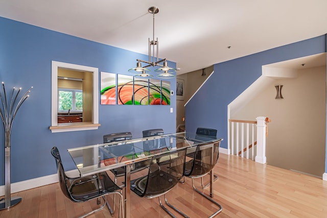 148 Breakwater Dr Unit 17, South Portland, ME 04106 - dining space featuring wood finished floors and a chandelier