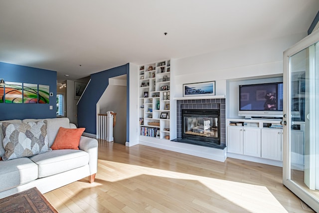 148 Breakwater Dr Unit 17, South Portland, ME 04106 - living area with a tile fireplace and light wood-style floors