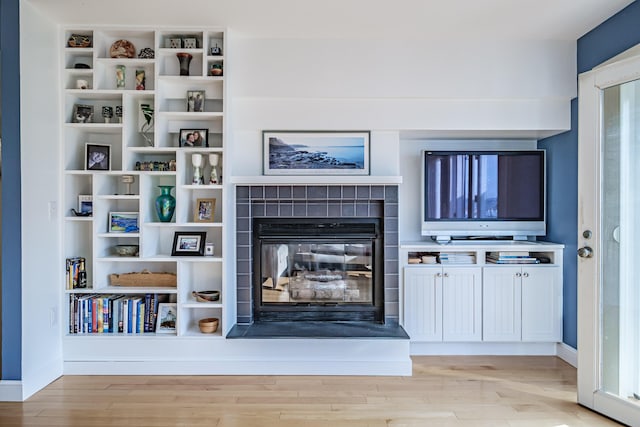 148 Breakwater Dr Unit 17, South Portland, ME 04106 - living area with light wood-type flooring and a tiled fireplace