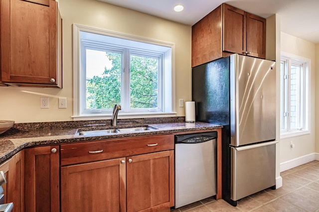 148 Breakwater Dr Unit 17, South Portland, ME 04106 - kitchen with appliances with stainless steel finishes, brown cabinetry, dark stone counters, and recessed lighting