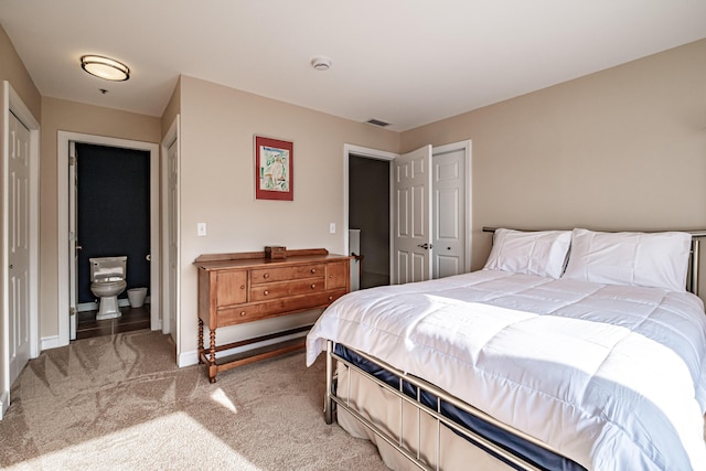 148 Breakwater Dr Unit 17, South Portland, ME 04106 - bedroom featuring light carpet, a closet, and connected bathroom