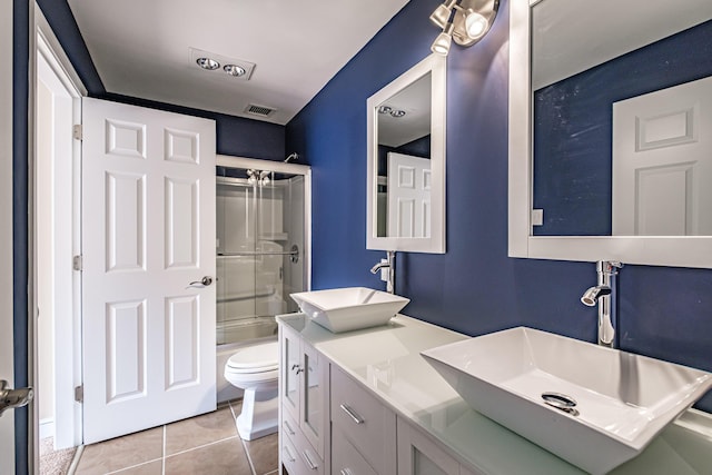 148 Breakwater Dr Unit 17, South Portland, ME 04106 - full bathroom featuring double vanity, tile patterned flooring, and bath / shower combo with glass door