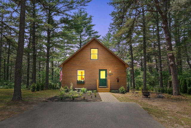 8 Log Cabin Ln Unit 9, Shapleigh, ME 04076 - chalet / cabin featuring faux log siding and a fire pit