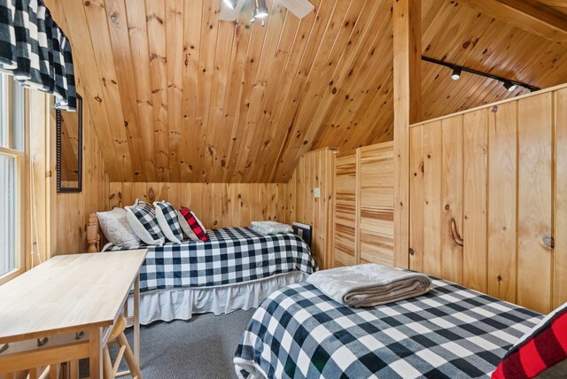 8 Log Cabin Ln Unit 9, Shapleigh, ME 04076 - carpeted bedroom with track lighting, lofted ceiling, wood ceiling, and wood walls
