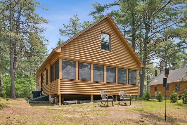 8 Log Cabin Ln Unit 9, Shapleigh, ME 04076 - rear view of house with faux log siding