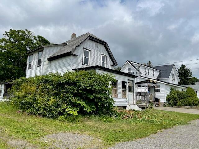 18 Birch St, East Millinocket, ME 04430 - view of front of house featuring a chimney