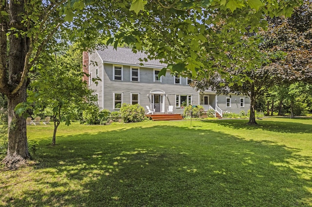 15 Harvey Brook Dr, Freeport, ME 04032 - colonial inspired home with a front yard, a chimney, and a shingled roof