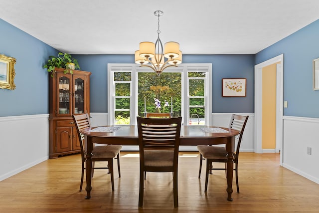 15 Harvey Brook Dr, Freeport, ME 04032 - dining area with a chandelier and light wood-style flooring