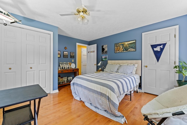 15 Harvey Brook Dr, Freeport, ME 04032 - bedroom featuring light wood finished floors, a closet, and a ceiling fan