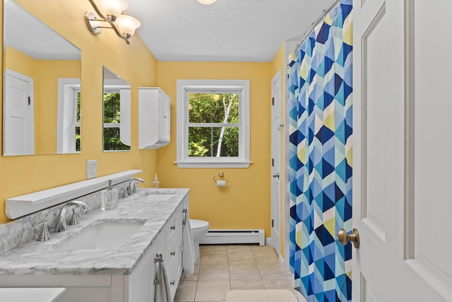 15 Harvey Brook Dr, Freeport, ME 04032 - bathroom featuring a baseboard radiator, double vanity, a shower with curtain, a textured ceiling, and tile patterned flooring