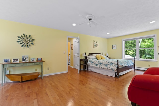 15 Harvey Brook Dr, Freeport, ME 04032 - bedroom featuring baseboard heating, light wood finished floors, recessed lighting, and a ceiling fan
