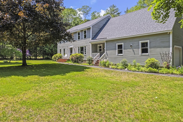 15 Harvey Brook Dr, Freeport, ME 04032 - colonial home with a shingled roof, a front lawn, and a garage