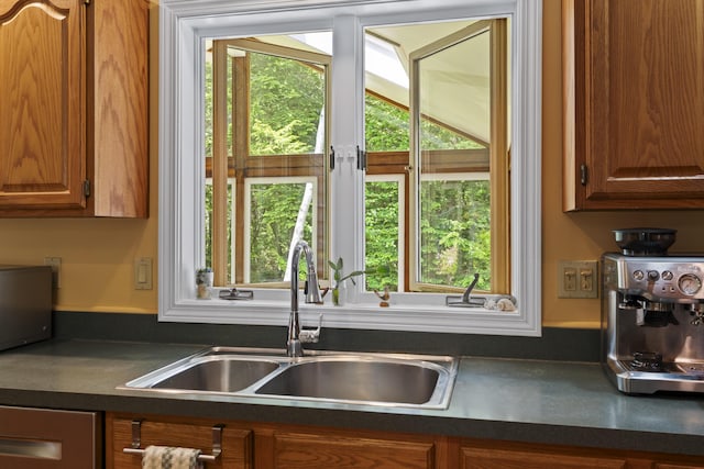 15 Harvey Brook Dr, Freeport, ME 04032 - kitchen with dark countertops, brown cabinets, and dishwashing machine