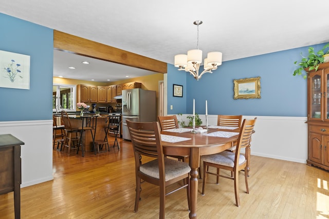 15 Harvey Brook Dr, Freeport, ME 04032 - dining space featuring light wood-type flooring, a chandelier, beamed ceiling, and recessed lighting
