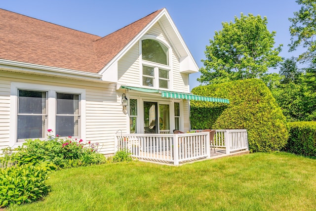 97 Dockside Ln Unit 8, Belfast, ME 04915 - view of front facade featuring a shingled roof and a front lawn