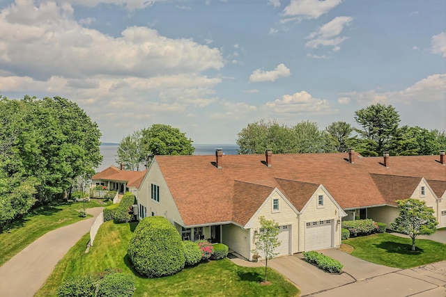 97 Dockside Ln Unit 8, Belfast, ME 04915 - view of front of house with driveway, a front yard, and an attached garage