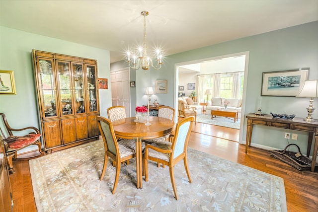 97 Dockside Ln Unit 8, Belfast, ME 04915 - dining area featuring light wood-style flooring and a chandelier