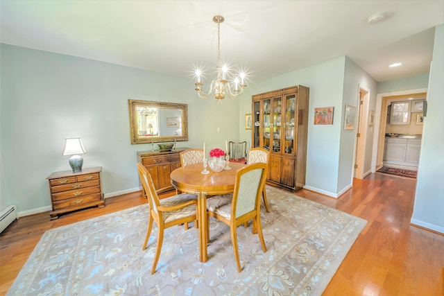 97 Dockside Ln Unit 8, Belfast, ME 04915 - dining space featuring wood finished floors and a chandelier