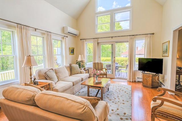 97 Dockside Ln Unit 8, Belfast, ME 04915 - living area featuring a wall mounted AC, high vaulted ceiling, light wood-type flooring, and a baseboard heating unit