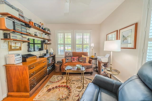 97 Dockside Ln Unit 8, Belfast, ME 04915 - living area with light wood-style floors and ceiling fan