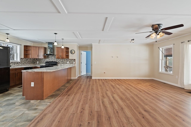 431 Bardon Hill Rd, Etna, ME 04434 - kitchen featuring open shelves, black electric range oven, wall chimney range hood, brown cabinets, and a peninsula