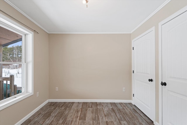 431 Bardon Hill Rd, Etna, ME 04434 - spare room featuring wood finished floors and crown molding