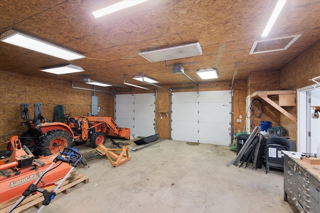 431 Bardon Hill Rd, Etna, ME 04434 - garage with electric panel and a garage door opener