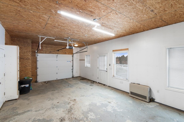431 Bardon Hill Rd, Etna, ME 04434 - garage with a garage door opener and heating unit