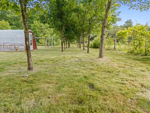 431 Bardon Hill Rd, Etna, ME 04434 - view of green lawn with a greenhouse and an outbuilding