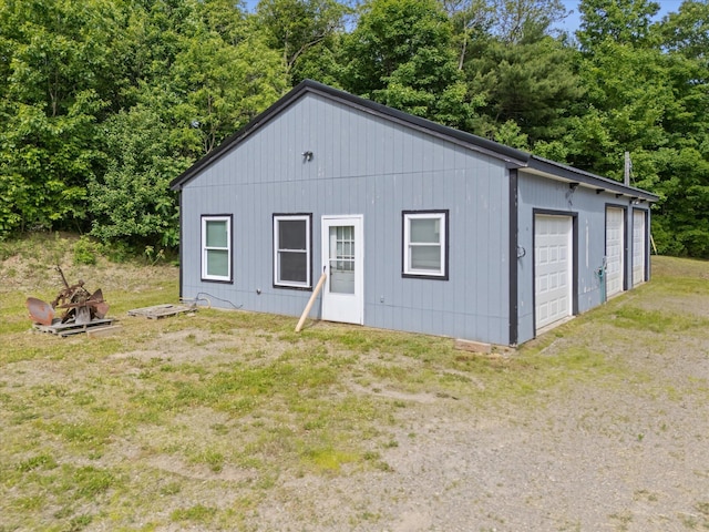 431 Bardon Hill Rd, Etna, ME 04434 - view of front of house with a garage and a front lawn
