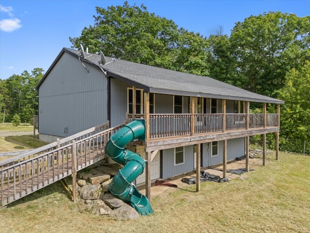 431 Bardon Hill Rd, Etna, ME 04434 - back of property with a playground, a lawn, and roof with shingles