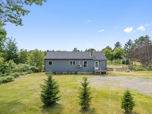 431 Bardon Hill Rd, Etna, ME 04434 - rear view of house featuring a lawn, a chimney, and a deck