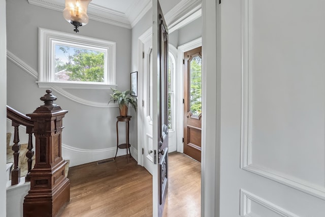 58 Church St, Belfast, ME 04915 - entrance foyer with plenty of natural light, light wood-type flooring, and ornamental molding
